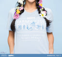 A woman wearing FarmHouse Fresh Smurfy Day To Save Donation T-Shirt in Blue color. All profits support urgent animal rescues.