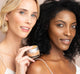 Two women of different skin color are demonstrating their beautiful complexions with a golden glow after using FarmHouse Fresh Golden Moon Dip Illumination Face Mousse with Retinol and Wrinkle-Targeting Peptides.
