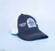 FarmHouse Fresh Smurfin' Cool Trucker Hat with a white mesh back and an embroidered patch featuring a donkey. All profits are donated to animal rescue initiatives around the country.