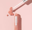A tube of FarmHouse Fresh Vitamin Glaze Oil Infused Lip Gloss in Peach Peony color.