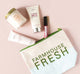 The signature Farmhouse Fresh Canvas Cosmetic Bag with logo and skincare products next to it.