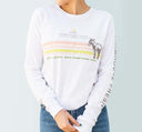 A woman wearing white FarmHouse Fresh Donation Long Sleeve Shirt that helps saves animals.