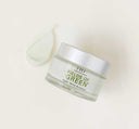 A jar and a texture smear of FarmHouse Fresh Fields of Green Organic Matcha Ultra-Soothing Face Moisturizer that hydrates, soothes and rejuvenates skin.