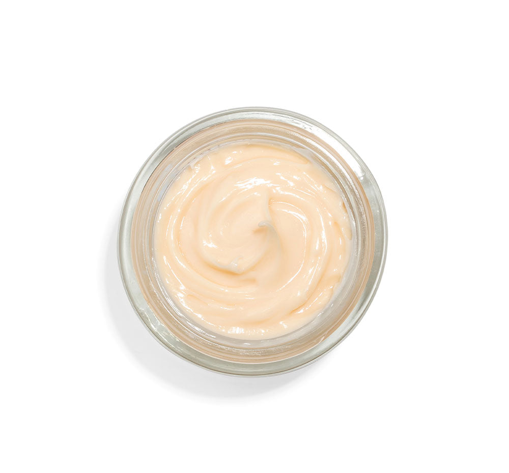 Top view of an opened jar of FarmHouse Fresh Stunning Returns facial Butter made with bakuchiol, a proven retinol alternative, Astaxanthin algae (6x more antioxidants than vitamin C) and peptides called the instant Botox deliverers.