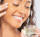 A woman is applying FarmHouse Fresh Watercress Hydration Cascade Gelee Moisturizer with retinol on her face to deeply hydrate her skin.