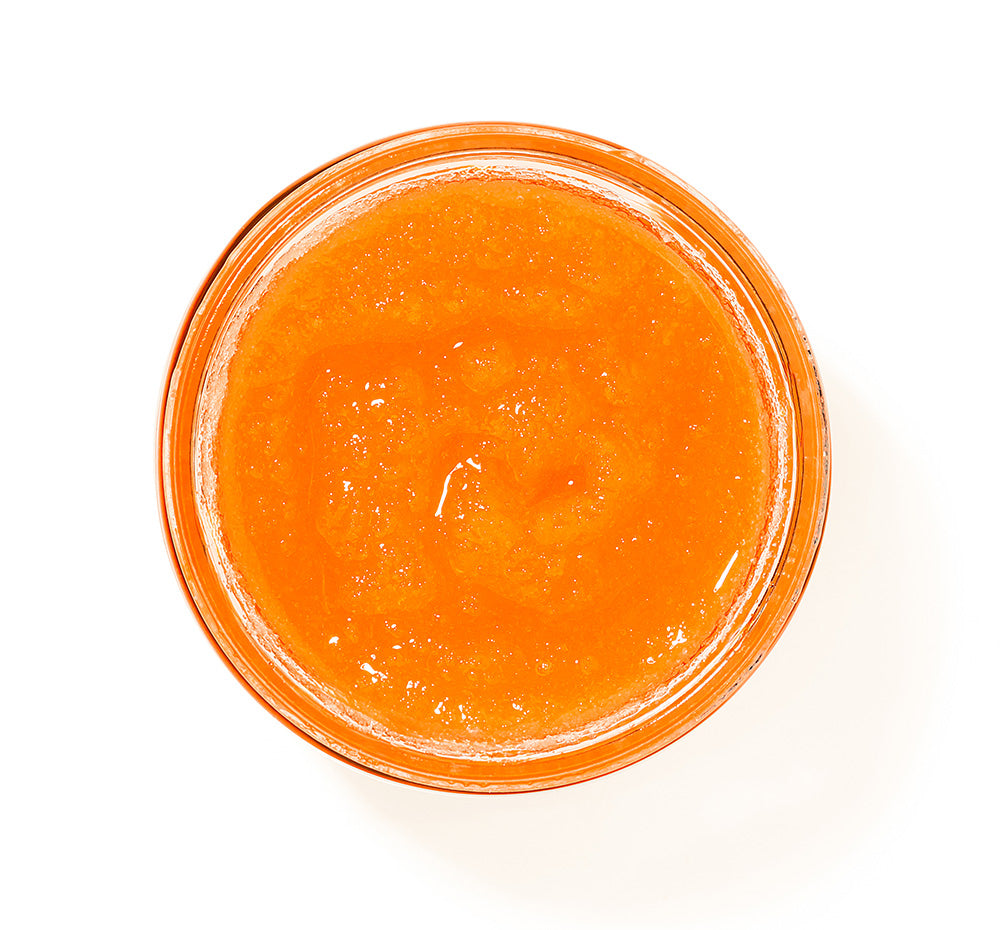 FHF Blood Orange Glowrita body polish top view of the open jar, showing rich orange color of the body polish