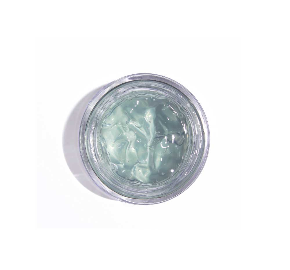 Top view of an opened jar of FarmHouse Fresh Blue Lotus Hydration Cascade Moisturizer, revealing its light gel texture boosted with retinol and peptides.