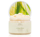 A jar of FarmHouse Fresh Citrus Grass nourishing body scrub with refreshingly light citrus cream scent.