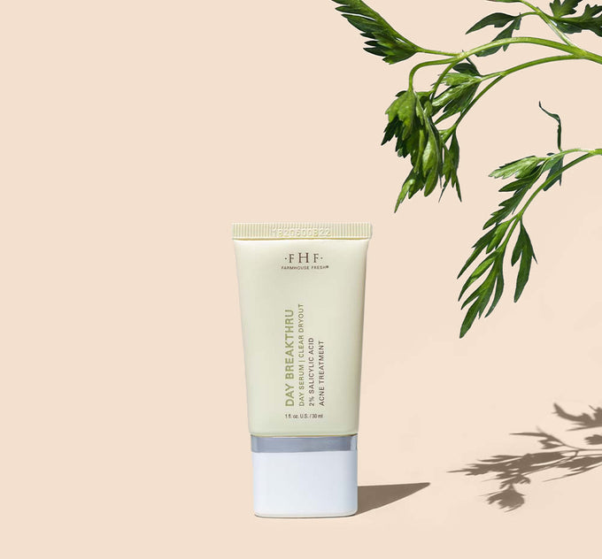 A tube of FarmHouse Fresh Day Breakthru Day Serum acne treatment that helps eliminate blemishes and blackheads.