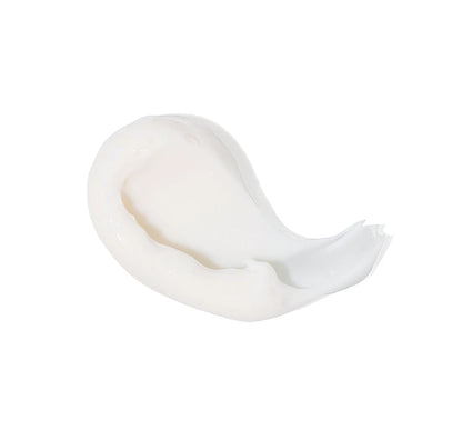Texture swipe on white of DreamWell™ Magnesium Organic Shea Butter Body Cream