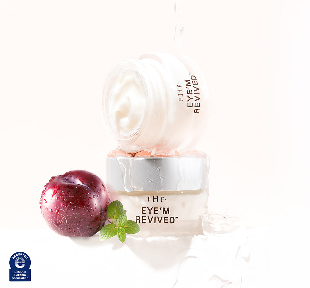 Eye'm Revived eye cream with plum and stevia leaf on a white background.