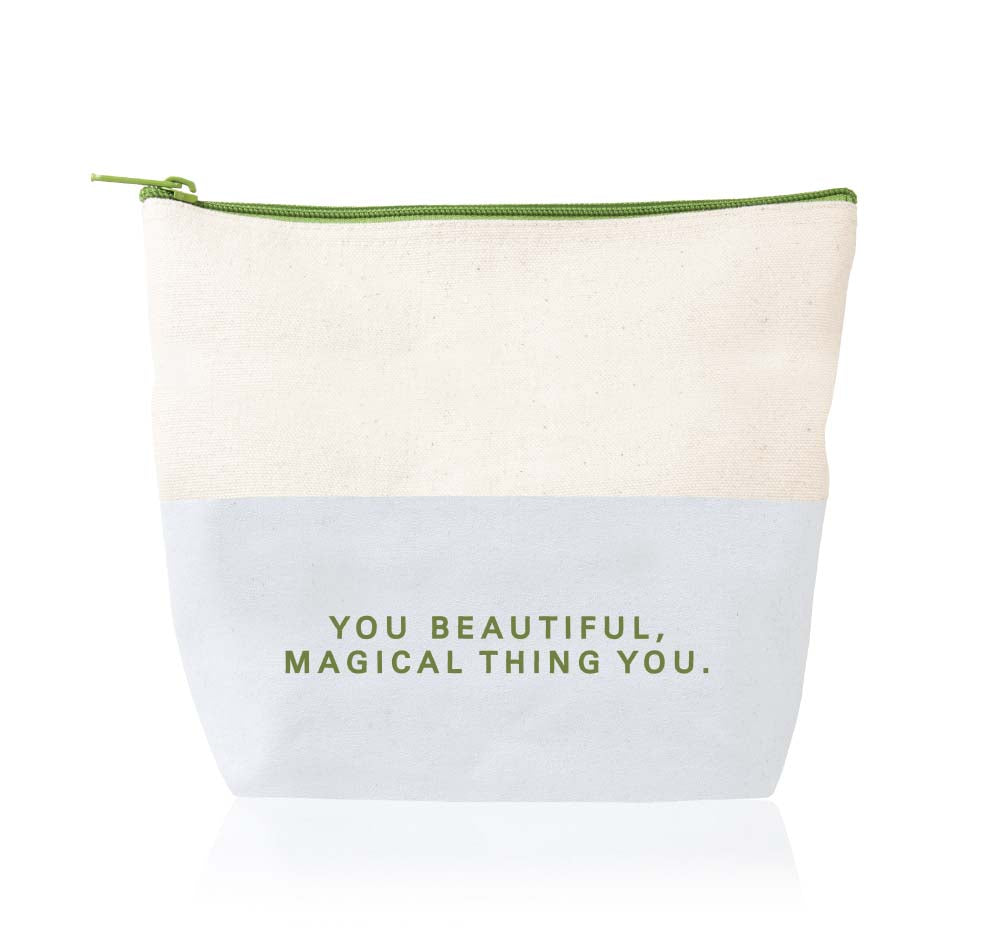 The back side of the canvas cosmetic bag that houses all the body care products that come in Quench On-the-Go Limited Edition Gift set. The print on the back side reads: You beautiful, magical thing you.