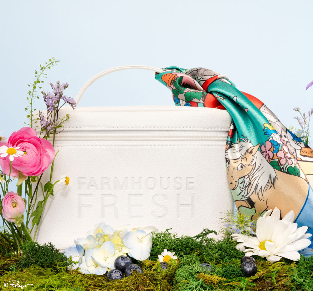 FarmHouse Fresh Vegan Leather Cosmetic Bag with Smurf Village Silky Scarf surrounded by flowers. All profits help save animals.