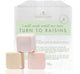 Three Sweet Bath Fizzers by FarmHouse Fresh next to a carrying wax bag. 