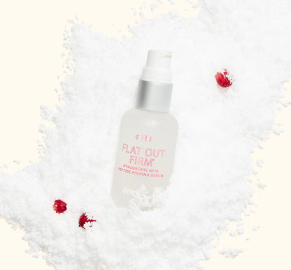 FarmHouse Fresh Flat Out Firm Hyaluronic Acid Peptide Firming Serum styled with festive holiday greenery and ornaments