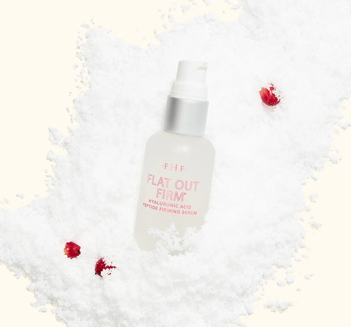 FarmHouse Fresh Flat Out Firm Hyaluronic Acid Peptide Firming Serum styled with festive holiday greenery and ornaments