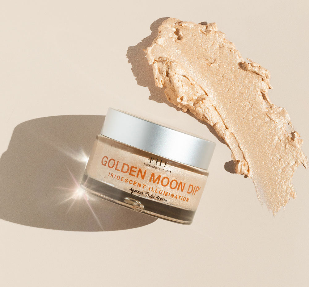 A jar and a swatch of FarmHouse Fresh Golden Moon Dip face Mousse with Retinol and Wrinkle-Targeting Peptides that can be used as a daily moisturizer or under makeup.