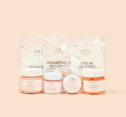 Jet Set Glow 7-piece sample kit designed to smooth, brighten, and illuminate your skin in a clear vinyl snap bag.