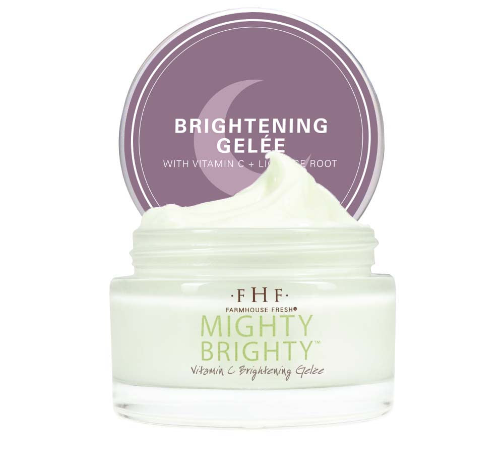 A jar of FarmHouse Fresh Mighty Brighty Vitamin C Brightening face moisturizer that leaves skin Incredibly soft, smooth and glowing.