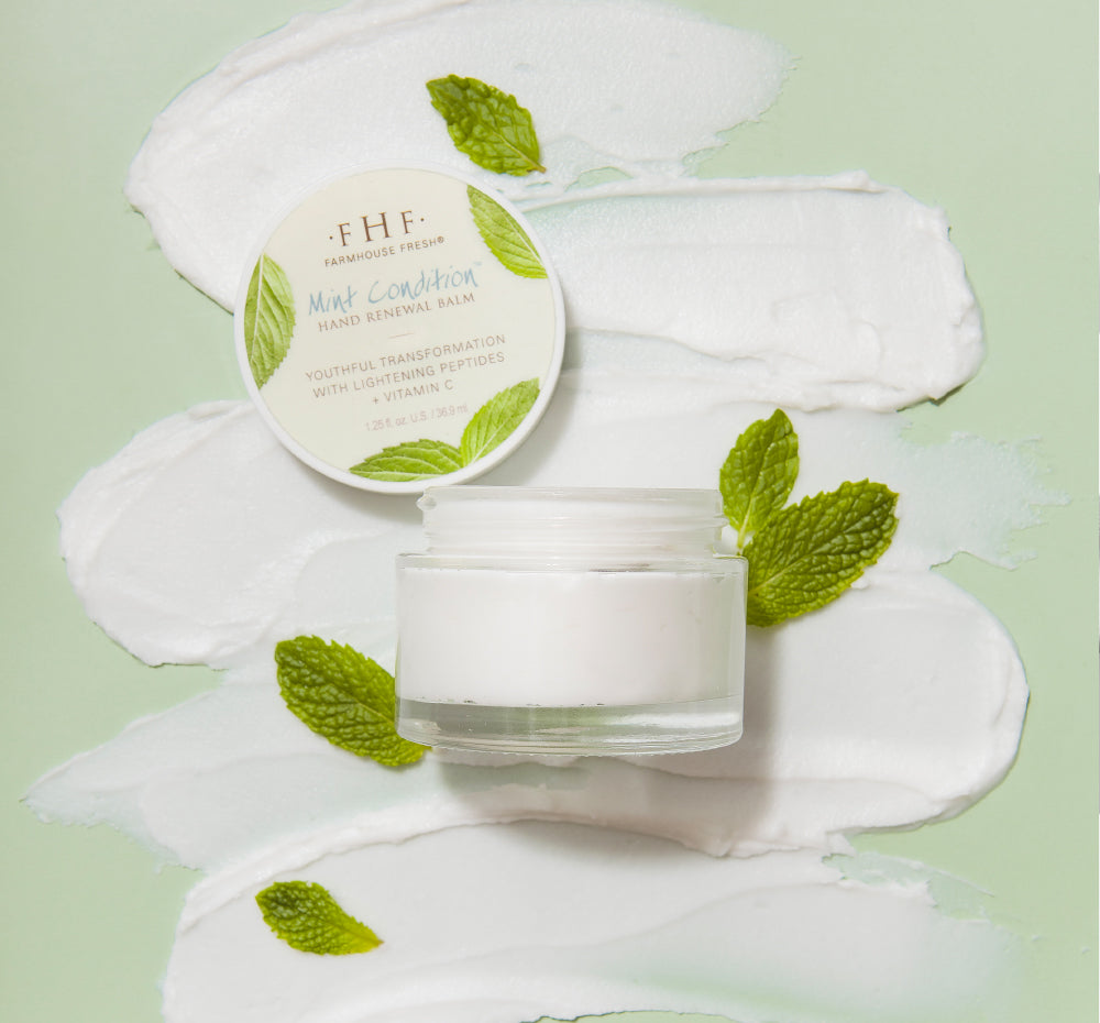 An open jar of Mint Condition Balm made with shea butter to help fight dullness