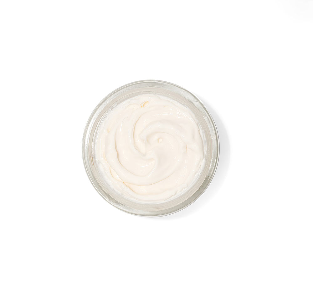 Top view of an opened jar of FarmHouse Fresh Necks-Level Smooth Neck Cream that helps aging skin look more smooth and even-toned.