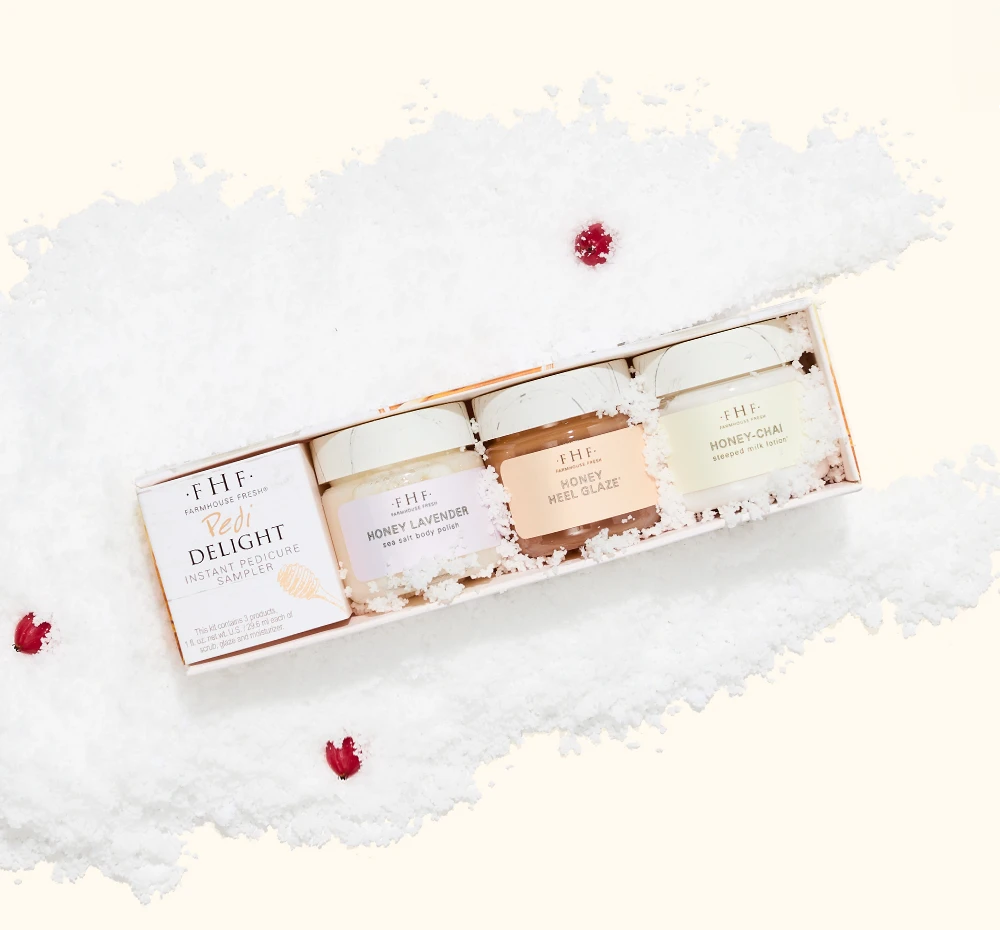 FarmHouse Fresh Pedi Delight Instant Pedicure Sampler styled with festive holiday greenery and red berries