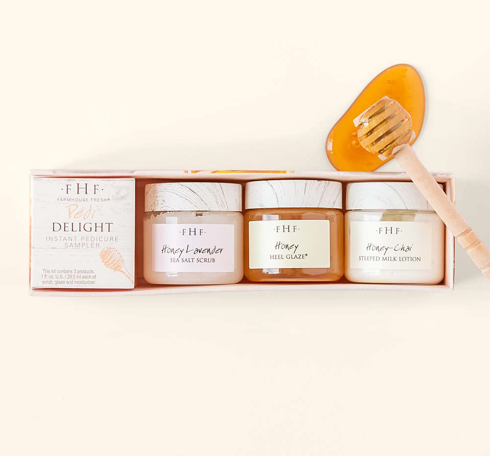 A box with three jars from Pedi Delight Instant Pedicure Sampler by FarmHouse Fresh. The set contains salt scrub, Honey Heel Glaze and a body lotion.