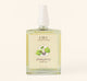 A bottle of FarmHouse Fresh Quinsyberry Botanical Body Oil with a light, unisex apple blossom and tea scent.