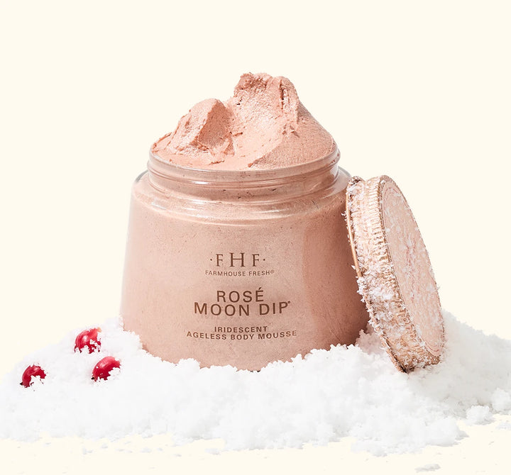 FarmHouse Fresh Rose Moon Dip Ageless Facial Sleep Mousse styled with festive holiday greenery and red berries