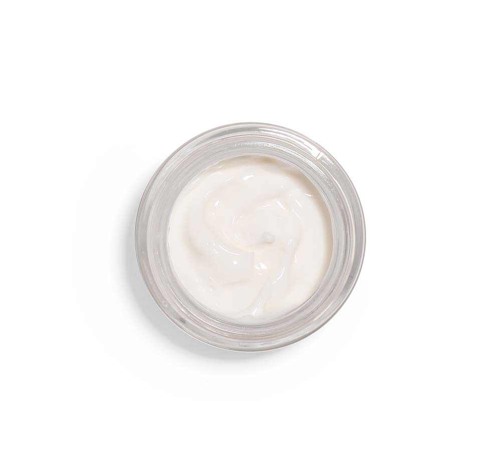 Top view of an opened jar of FarmHouse Fresh Three Milk Ageless Sleep Cream with a time-release delivery system of pure form retinol.