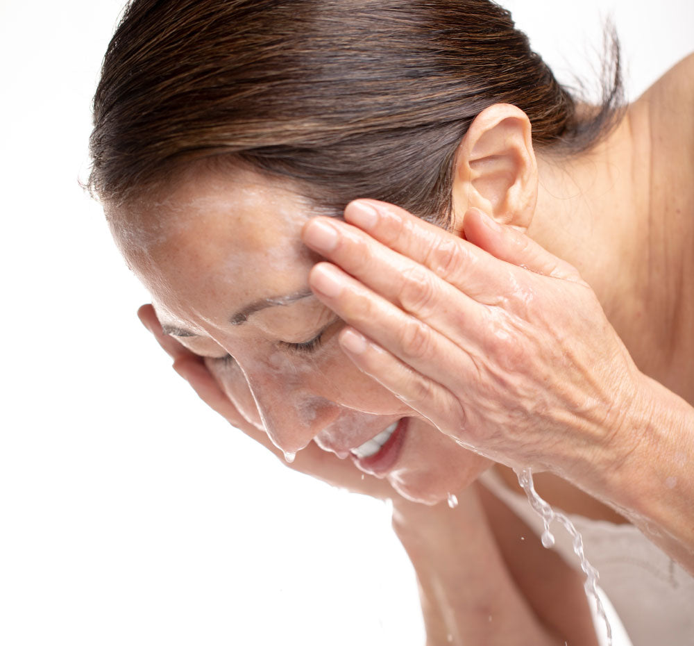 A woman washing off A woman holding up Three Milk Whipfoliant