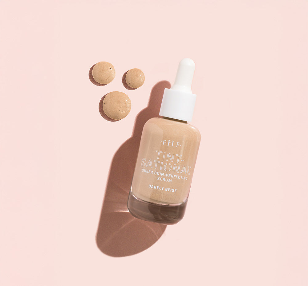 Tint-sational™ Sheer Skin-Perfecting Serum bottle in shade BArely Beige with  product droplets