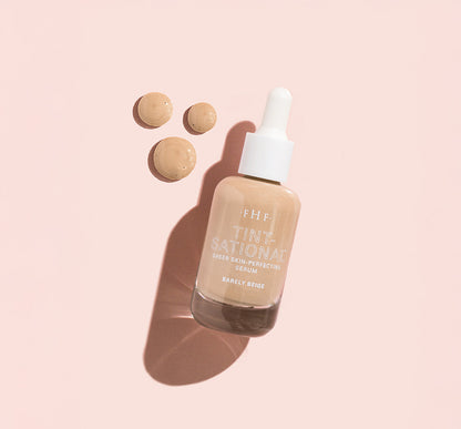 Tint-sational™ Sheer Skin-Perfecting Serum bottle in shade BArely Beige with  product droplets