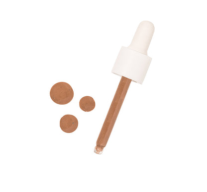 Tint-sational Serum dropper with tan to dark serum drops