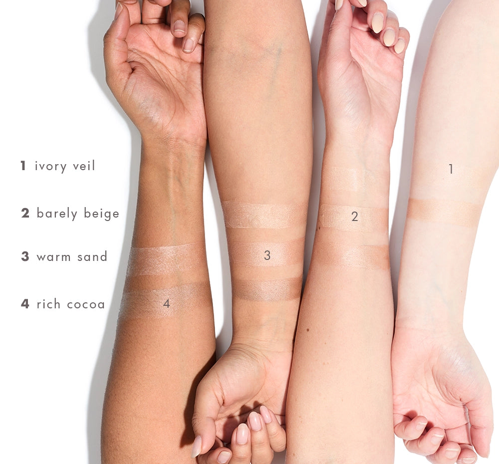 Hands and arms showing different Tint-sational color swatches on a white background