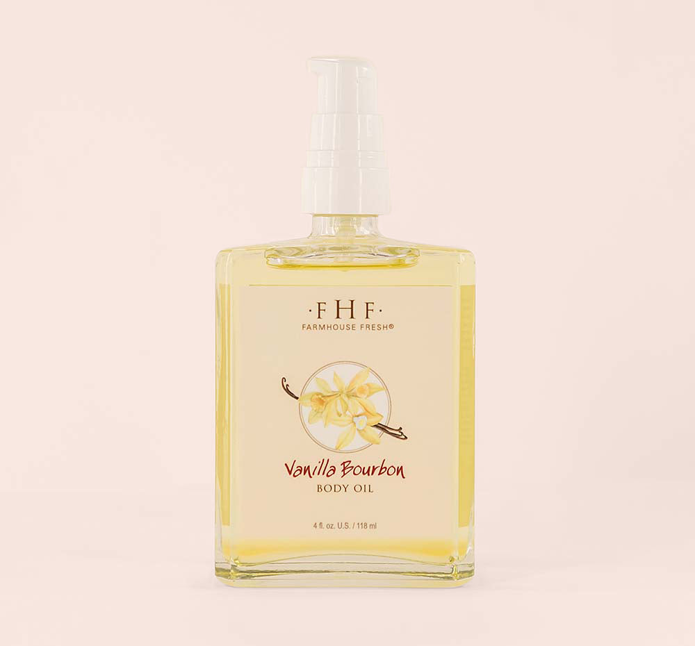 A bottle with pump of Vanilla Bourbon Body Oil by FarmHouse Fresh that is also perfect as massage oil.