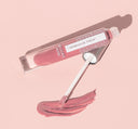 A tube of FarmHouse Fresh Vitamin Glaze Oil Infused Lip Gloss in Delicate Rose color.