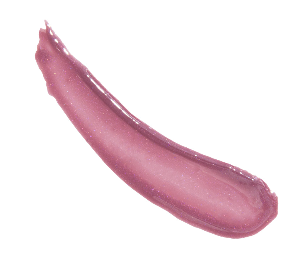 A swatch of FarmHouse Fresh Vitamin Glaze Lip Gloss in Violet Orchid color that moisturizes lips and brings a pretty shine.