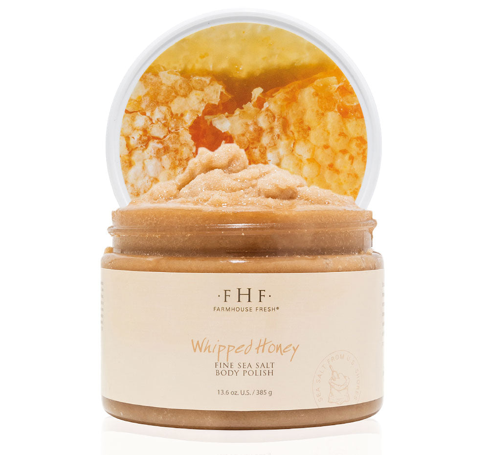 A jar of FarmHouse Fresh Whipped Honey Fine Sea Salt Body Polish made with natural and vegan ingredients.