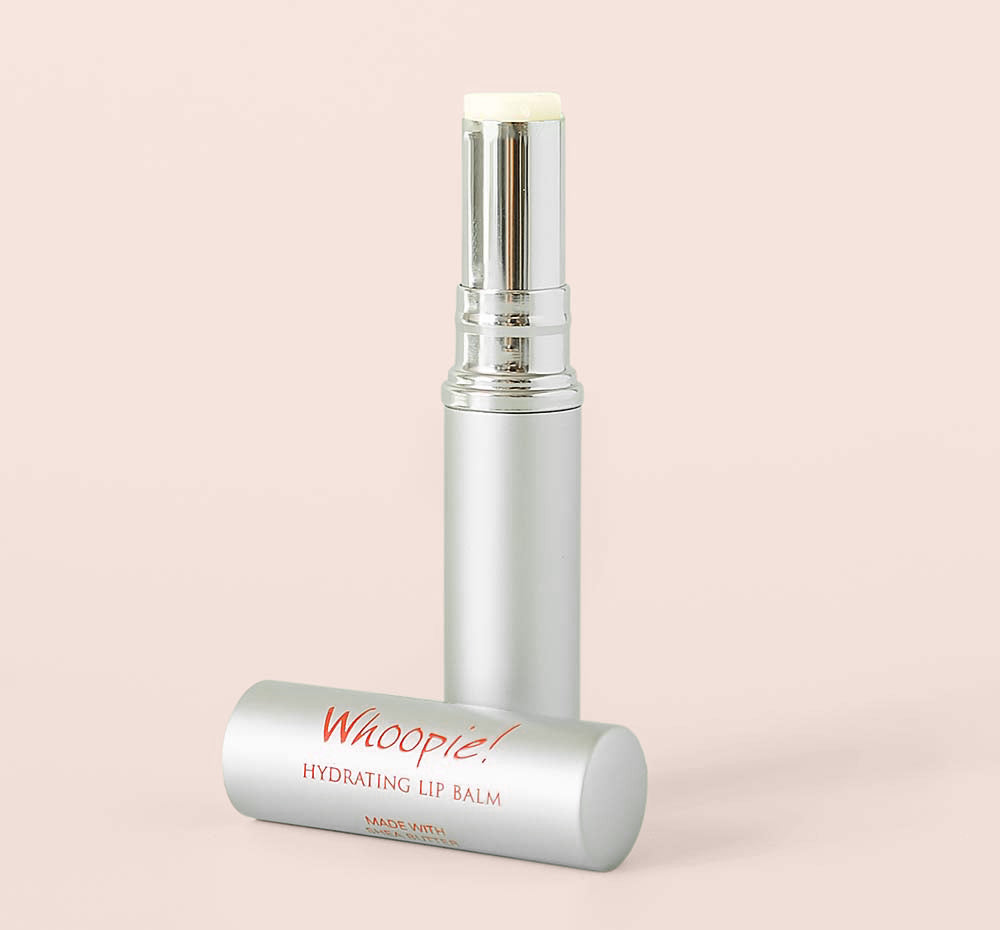 A metal tube of Whoopie Hydrating Lip Balm by Farmhouse Fresh, scented like a freshly baked cake.