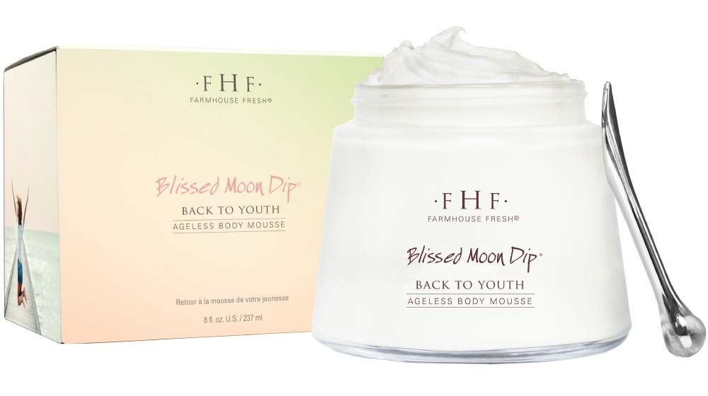 A jar of Blissed Moon Dip Back To Youth Ageless Body Mousse by FarmHouse Fresh next to a box.