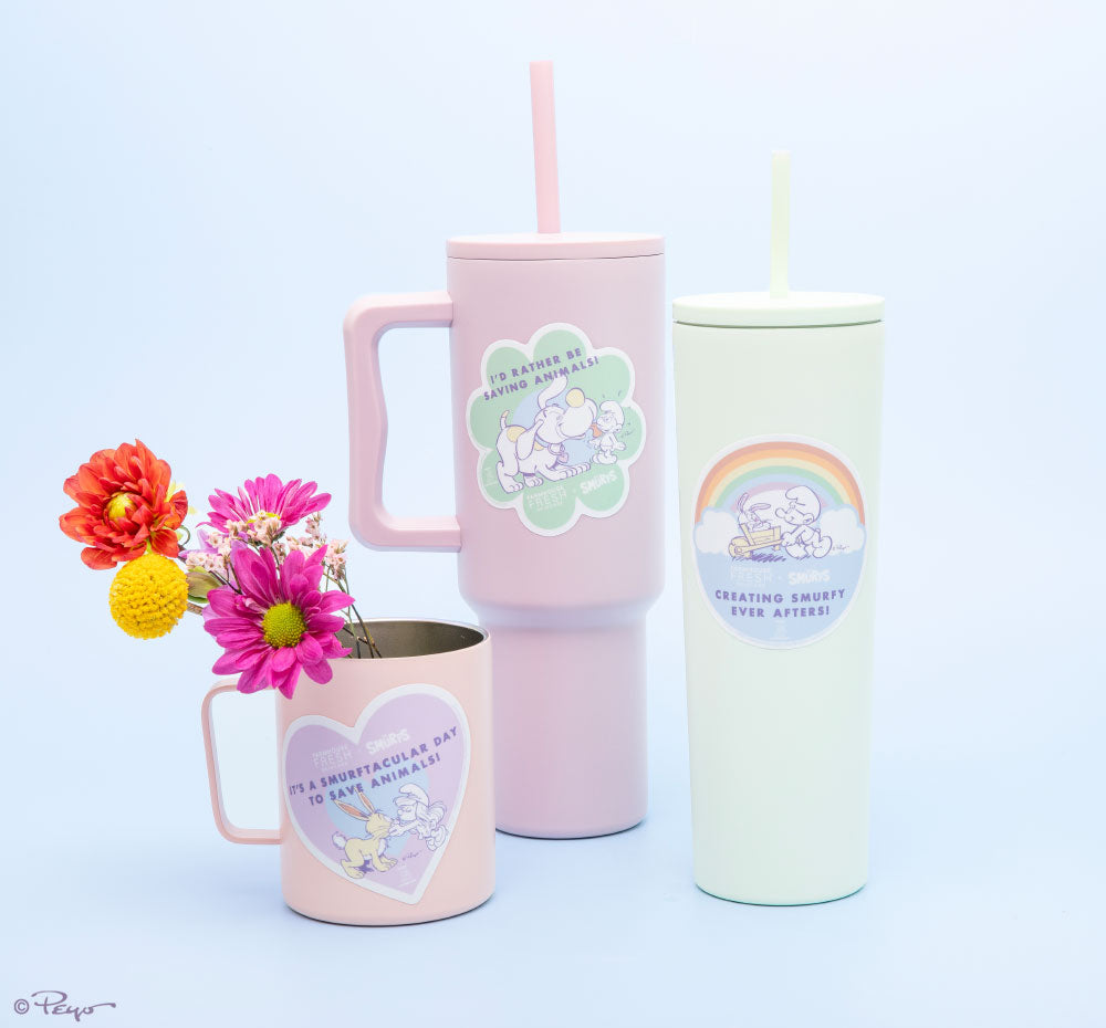 FarmHouse Fresh Smurf-sational Jumbo Stickers displayed on tumblers and a mug. All profits benefit animal rescue initiatives around the country.