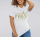 A woman wearing a FarmHouse Fresh® Donation T-Shirt in Blue color, which helps rescue farm animals.