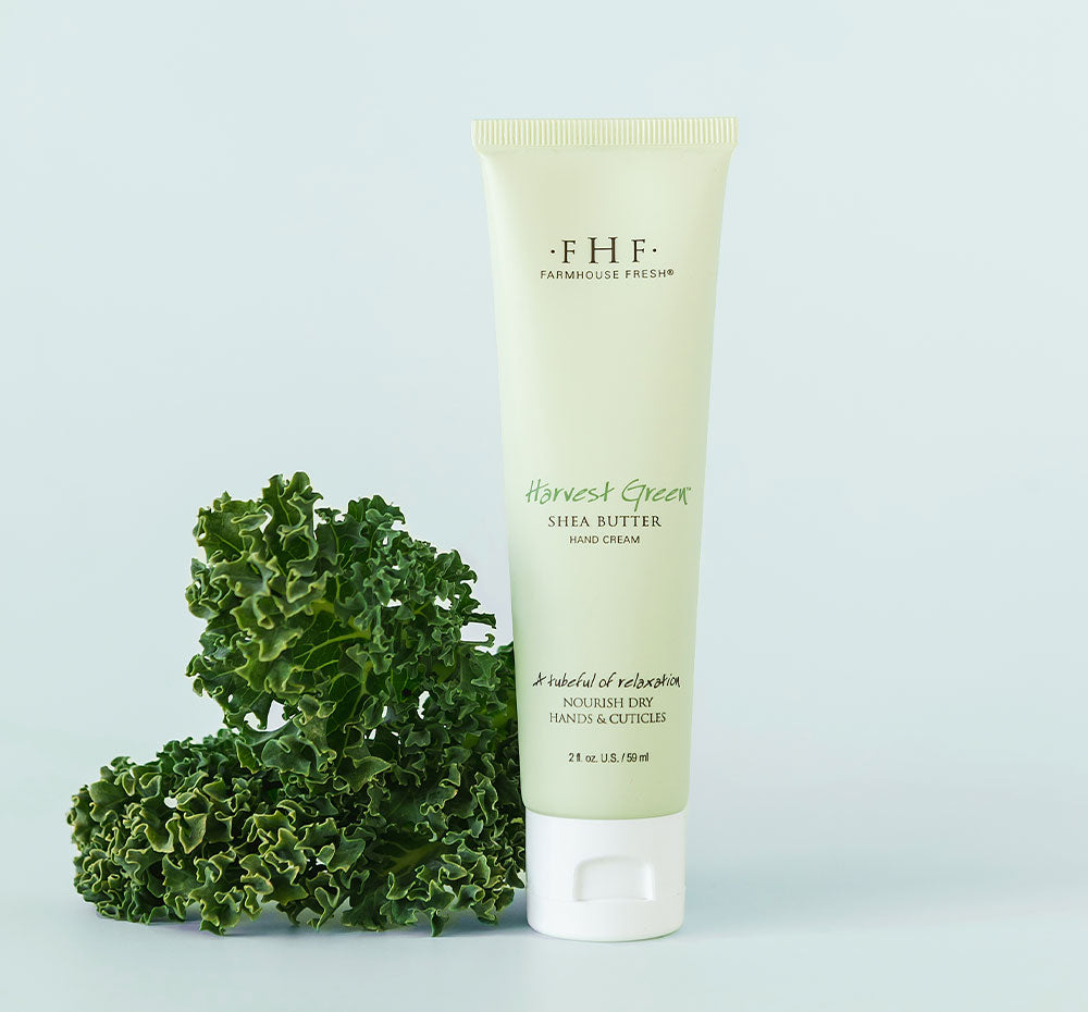 A tube of FarmHouse Fresh Harvest Green Shea Butter for hands with relaxing fresh notes of lemongrass & green melon.