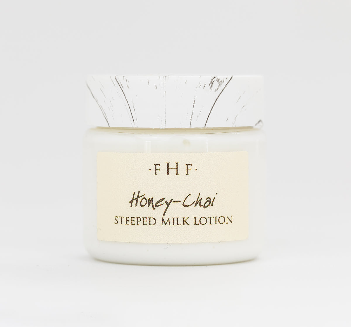 A sample of Honey-Chai Steeped Milk lotion for body by Farmhouse Fresh.