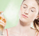 A woman is spraying her face with FarmHouse Fresh Illumination Juice Facial Toner made with fruit extracts, botanical oils and powerful peptides that brighten skin.