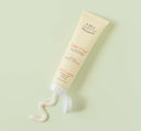 A tube of Island Elixir Organic Shea Butter Hand Cream by FarmHouse Fresh with a pleasant coconut and pineapple scent.