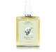 A bottle of Juniper Ale body oil by FarmHouse Fresh infused with natural botanical extracts.