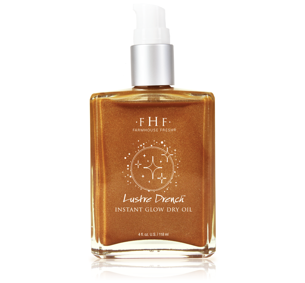 A bottle of FarmHouse Fresh Lustre Drench Instant Glow Dry Oil that gives skin a nice shimmer and just a hint of color.