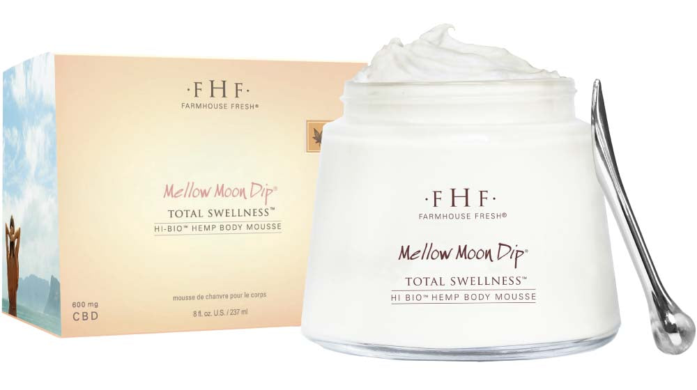 A box and a jar of Mellow Moon Dip Body mousse with an application wand, a light moisturizing body cream infused with full-spectrum hemp oil with CBD.